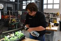 student watering plants